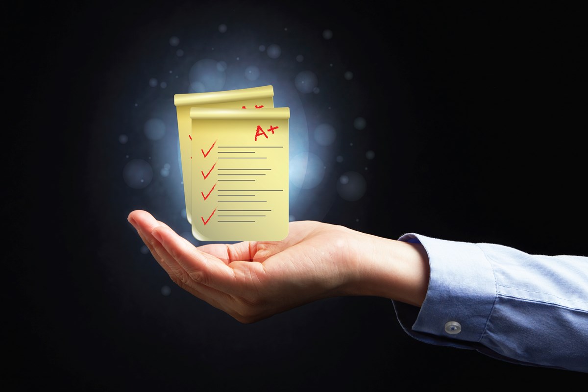 Online Assessment Software - Product Features Canva Hand Presenting Exam Papers